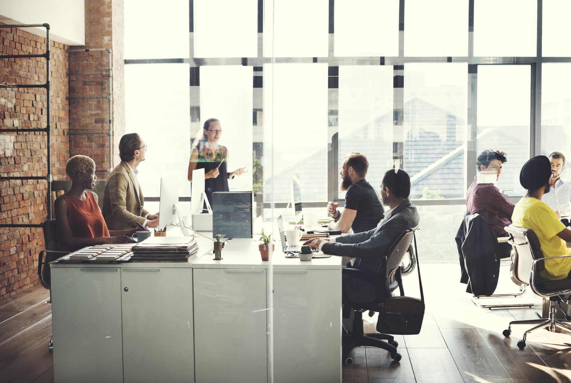 A team collaborating in a bright open-plan office