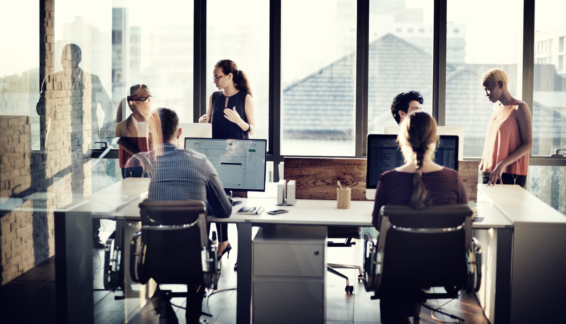 A team collaborating in a bright open-plan office
